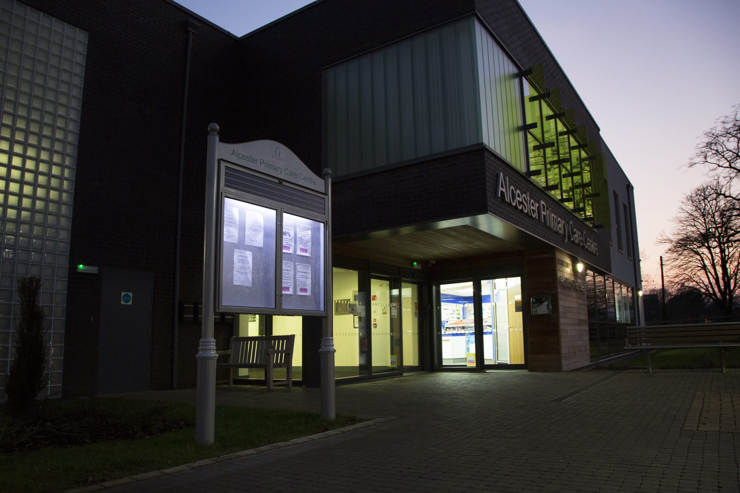 Solar power sign outside Alcester Primary Care Centre in the late evening